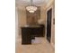 Chophouse entrance featuring a stone wall accent, dark wood accents, and elegant lighting at 7745 Somersworth Dr, Kissimmee, FL 34747