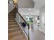 Beautiful staircase with rod iron spindles leading to an open-concept living space with backyard view at 7745 Somersworth Dr, Kissimmee, FL 34747