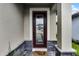 Inviting front door features decorative glass, and a 'Home Sweet Home' welcome mat at 7745 Somersworth Dr, Kissimmee, FL 34747
