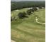 Expansive golf course with lush green fairways, trees, and manicured greens at 7745 Somersworth Dr, Kissimmee, FL 34747