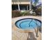 Community hot tub surrounded by lush landscaping, perfect for relaxation and social gatherings at 7745 Somersworth Dr, Kissimmee, FL 34747