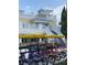 Shark Lounge exterior with white railings, stairs and signage offering an upscale and relaxed atmosphere at 7745 Somersworth Dr, Kissimmee, FL 34747