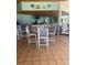 Inviting poolside bar area with seating and a full bar, perfect for relaxing and enjoying refreshments at 7745 Somersworth Dr, Kissimmee, FL 34747