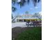Elegant restaurant exterior with decorative railings, stairs and a clock tower. Rental bikes available at 7745 Somersworth Dr, Kissimmee, FL 34747