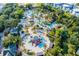 Aerial view of the community water park with lazy river, pools, slides and playground at 7745 Somersworth Dr, Kissimmee, FL 34747