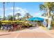Reunion Water Park entrance featuring covered bike rentals, shady spots and blue skies at 7745 Somersworth Dr, Kissimmee, FL 34747