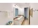 A bright bathroom featuring a double sink vanity and framed mirror with modern light fixtures at 8851 Fallen Oak Dr, Davenport, FL 33896