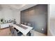 Elegant dining room featuring modern wall paneling, a sleek dining table, and chic decor at 8851 Fallen Oak Dr, Davenport, FL 33896