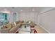 Spacious living room with archway, tile floors, modern decor, and cozy sectional sofa with ample seating at 8851 Fallen Oak Dr, Davenport, FL 33896
