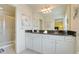 Bathroom featuring a double vanity, granite countertops, and a glass-enclosed shower at 8989 Rhodes St, Kissimmee, FL 34747