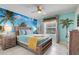 Tropical-themed bedroom with vibrant beach mural, straw accents, and bright decor at 8989 Rhodes St, Kissimmee, FL 34747
