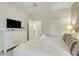 Comfortable bedroom with a dresser, closet, and a plush white comforter at 8989 Rhodes St, Kissimmee, FL 34747