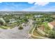 Well-manicured landscaping at the community entrance with pond and clubhouse at 8989 Rhodes St, Kissimmee, FL 34747