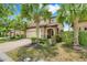 Beautiful home with a two-car garage, brick driveway, and a well-manicured lawn at 8989 Rhodes St, Kissimmee, FL 34747