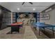 Spacious game room with Star Wars themed mural, pool table and ping pong at 8989 Rhodes St, Kissimmee, FL 34747