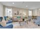 Cozy living room with modern decor, comfortable seating, neutral colors, and stylish airplane-themed art at 8989 Rhodes St, Kissimmee, FL 34747