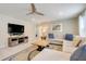 Relaxing living room with a large sofa, entertainment center, and open layout at 8989 Rhodes St, Kissimmee, FL 34747