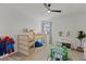 Charming bedroom with a bunk bed, play area, and natural light, perfect for and relaxation at 14189 Larkspur Lake Dr, Winter Garden, FL 34787