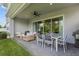 Inviting covered patio with ample seating, a ceiling fan, and an outdoor dining set, perfect for entertaining at 14189 Larkspur Lake Dr, Winter Garden, FL 34787