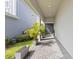 Welcoming entryway with a tiled floor, leading to a stylish front door with manicured planters at 14189 Larkspur Lake Dr, Winter Garden, FL 34787
