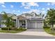 Charming two-story home with a manicured front yard and a two-car garage, perfect for suburban living at 14189 Larkspur Lake Dr, Winter Garden, FL 34787