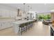Spacious kitchen featuring a large center island, stainless steel appliances, and modern pendant lighting at 14189 Larkspur Lake Dr, Winter Garden, FL 34787