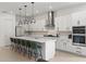 Bright kitchen with a large island, modern appliances, and sleek white cabinetry at 14189 Larkspur Lake Dr, Winter Garden, FL 34787