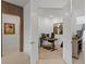 Home office inside double doors, features a modern desk, ergonomic chair, and natural light, next to the stairs at 14189 Larkspur Lake Dr, Winter Garden, FL 34787