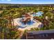 Aerial view of the community splash pad, surrounded by lush landscaping and seating at 1003 Nathan Ridge Rd, Clermont, FL 34715