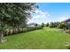 Spacious backyard with lush lawn and iron fence at 1003 Nathan Ridge Rd, Clermont, FL 34715