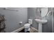 Powder room featuring modern fixtures, vanity, toilet and neutral paint at 1003 Nathan Ridge Rd, Clermont, FL 34715