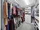 Walk-in closet with built-in shelving and ample storage for clothes and shoes at 1003 Nathan Ridge Rd, Clermont, FL 34715