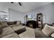 Comfortable living room with modern decor, ceiling fan, and tile flooring at 1003 Nathan Ridge Rd, Clermont, FL 34715