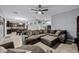 Spacious living room with modern decor, tile floors, and open concept to kitchen at 1003 Nathan Ridge Rd, Clermont, FL 34715