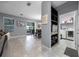 Open-concept living space featuring tile flooring and a view into the laundry room at 1003 Nathan Ridge Rd, Clermont, FL 34715