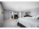 Bright main bedroom featuring a fireplace and decorative mirror at 1003 Nathan Ridge Rd, Clermont, FL 34715