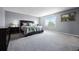 Spacious main bedroom with a large window and plush carpet flooring at 1003 Nathan Ridge Rd, Clermont, FL 34715
