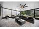 Spacious screened lanai provides ample seating, ceiling fan, and sunshade at 1003 Nathan Ridge Rd, Clermont, FL 34715
