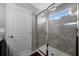 Modern shower with glass enclosure, tile walls, and a window for natural light at 1003 Nathan Ridge Rd, Clermont, FL 34715