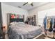 Bedroom featuring tiled floors, a window for natural light, and clothes rack at 10453 Old Studio Rd, Clermont, FL 34711