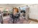 Bright dining room with unique high backed chairs and large windows at 10453 Old Studio Rd, Clermont, FL 34711