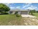 Charming single story home with a two car garage and neutral paint at 10453 Old Studio Rd, Clermont, FL 34711