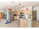 Traditional-style kitchen featuring stainless steel appliances and natural wood cabinets at 10453 Old Studio Rd, Clermont, FL 34711