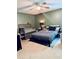 Comfortable bedroom with tiled floors, a modern crib, and stylish furnishings at 11714 Peachstone Ln, Orlando, FL 32821