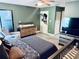 Comfortable bedroom with tiled floors, a modern crib, and stylish furnishings at 11714 Peachstone Ln, Orlando, FL 32821
