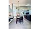 Open concept living and dining area features high ceilings, stylish decor, and lots of space at 11714 Peachstone Ln, Orlando, FL 32821