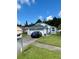 Traditional home boasts a well-manicured lawn and lovely landscaping for great curb appeal at 11714 Peachstone Ln, Orlando, FL 32821