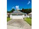 Well-maintained single-Gathering home with a 2-car garage and clean driveway at 11714 Peachstone Ln, Orlando, FL 32821