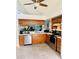 Well-lit kitchen with stainless steel appliances, plenty of counter space, and ample storage at 11714 Peachstone Ln, Orlando, FL 32821