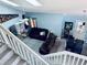 Top-down view of open-concept living space with tile floors, and a comfortable brown sofa set at 11714 Peachstone Ln, Orlando, FL 32821